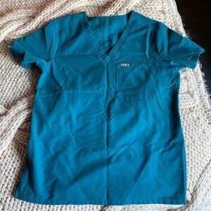 Teal scrub top FIGS size small. Worn once.